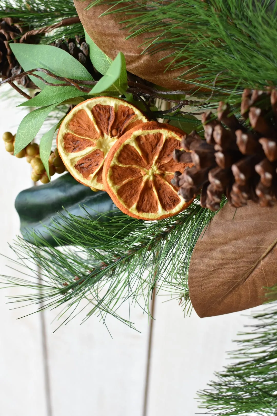 24" Faux Mixed Pine, Magnolia, Orange, and Berry Wreath